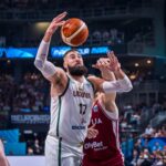 Jonas Valanciunas embraced a bench role as Lithuania beat Kristaps Porzingis and Latvia to book their EuroBasket 2025 quarter final place.