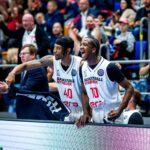 The first jump for an American baller to Europe can be crucial. Sir’Jabari Rice may have made the perfect choice for his future development and earnings. Emmet Ryan on how the former Texas Longhorn may have the perfect opportunity with ERA Nymburk in the Basketball Champions League. It was an opener that was expected to go well. It did. That really is besides the point. The way in which Sir’Jabari Rice impressed for ERA Nymburk against BC Sabah in the Basketball Champions League this week is quite promising for the former Texas Longhorns man. To thrive in Europe or get another look back home, you need to chart the right course. With the near perennial champions of Czechia, Rice appears to have found the best fit. The game I was on the call for ERA Nymburk’s comfortable BCL win over BC Sabah on Tuesday night. Through the first quarter and a half, it was nicely balanced, then the overall quality of Nymburk proved decisive. Rice was on the bench to start but ended up playing 23 minutes, with 22 points on 8 of 16 shooting, along with 4 rebounds and 4 assists. It was an impressive debut with largely smart shot selection. The former Texas Longhorns man leaned on the shots that worked for him. He drove for lay-ups to get the bulk of his points. While the 2 of 7 from deep was sub-optimal, he was largely taking good looks. This wasn’t a man forcing bad shots. Crucially, he was the opposite of a hog. Rice took 18 per cent of his team’s shots while accounting for 23 per cent of their points. With the eye test, he also got that his job was about more than scoring but doing the grunt work. On a team like Nymburk, nobody is exempt from grunt work. https://youtu.be/1s63U351tbY?si=0srR-bcgub7Zk0e_ BallinEurope is ramping up its YouTube game this season. Subscribe to our channel now for player exclusives, analysis videos, and much more. Putting it in context The BCL is fundamentally where Nymburk have to perform. They have won 21 of the last 22 national titles in Czechia and the gulf in quality is huge. While Opava took the title in 2023, that was an outlier in the extreme. A 33-3 record last season followed by another title last year was a return to the norm. It’s at the continental level where Nymburk seek challenges. In BC Sabah, from Azerbaijan, Sir’Jabari Rice and company were facing debutants in the competition. Having reached the quarter final playoffs last season, Nymburk were expected to roll and they did. In simple terms, this wasn’t a powerhouse. The overall competition standard is still high. Nymburk have reached the quarter final playoffs in 3 of the last 6 seasons and also had a quarter final run in the lower tier FIBA Europe Cup the year they were absent. The BCL, effectively Europe’s secondary championship, has also gotten deeper thanks to key defections from the rival Euroleague (Alba Berlin), and Eurocup (Joventut Badalona and Gran Canaria). BallinEurope has a book, a real life actual book called I Like it Loud, and you can buy it on Amazon now. It’s here as a book and here in Kindle form. The short-term picture While league games in Czechia won’t offer a huge level of competition, Sir’Jabari Rice can expect a solid grounding in the style of play on the continent through that part of the campaign. The BCL offers him a chance to shine…by not trying too hard to shine. Proving that he is a versatile piece and not just a scorer is the goal here. The rest of the group phase will give him better tests, with Elan Chalon (France) and the aforementioned Alba Berlin (Germany), providing excellent opportunities. Nymburk will be favoured to move on to the round of 16, where the likes of Unicaja Malaga, Tenerife, Gran Canaria, and Badalona will all be waiting. Throw in AEK, Galatasaray, and a few other heavyweights and there’s real room to grow for Rice in what is a veteran heavy league. It’s also a far more competitive form of basketball than what he experienced across his two years in the G League. Rounding out his game is crucial. The step At 26, Rice is a touch older than the usual rookie in European ball but still shy of his peak. A good season with Nymburk isn’t about putting up huge numbers, it’s about showing versatile value. If Rice can show efficiency on both ends then his chance to move up to a bigger opportunity is significant. Whether that’s getting an NBA look, moving up the food chain in Europe, or taking an opportunity in Asia, that combination of efficiency and versatility is vital. Nymburk is around the middle of the pack financially in the BCL but would be an outright pauper in Euroleague or even the standards of Japan or China. Other opportunities at Nymburk’s financial level may have simply relied on him to score heavily. With Nymburk’s roster construction, they’ve signed him with the need for more than that. The early signs are hugely positive and that bodes well for his future. (Picture: Basketball Champions League)